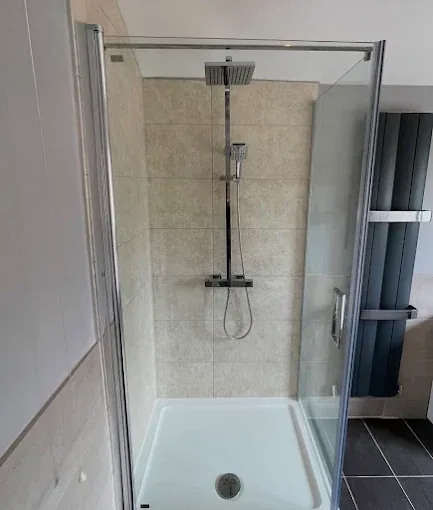 New shower enclosure with thermostatic mixer and rainfall head