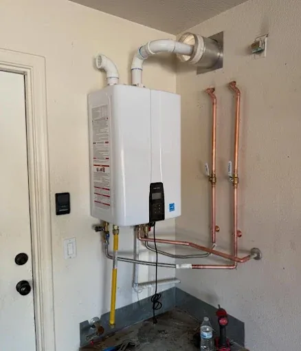 Wall mounted tankless water heater with new copper supply lines and gas piping